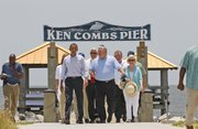 President Barack Obama walks with Mississippi Gov. Haley Barbour, center, Gulfport Mayor George Schloegel, rear, and others, after he met with residents affected by the BP Deepwater Horizon oil spill June 14 in Gulfport, Miss.