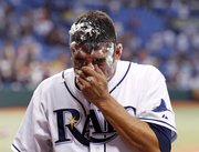Tampa Bay Rays pitcher Matt Garza wipes away the remains of a pie during a television interview after his no-hitter against the Tigers Monday in St. Petersburg, Fla. It was the fifth no-hitter of the season.