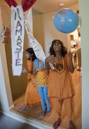 Kiren Cordes, 11, spins a globe ball during a break in activities at an an Indian Heritage Camp recently in Lawrence.