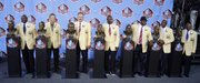 The 2010 pro football hall of fame class members pose next to their busts. The class, from left: Emmitt Smith, Dick LeBeau, Russ Grimm, John Randle, Rickey Jackson, Jerry Rice and Floyd Little. They were enshrined Saturday in Canton, Ohio.