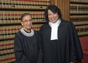 Justice Ruth Bader Ginsburg, left, and Justice Sonia Sotomayor pose for a photo in the Justices’ Conference Room in this file photo released Sept. 8, 2009, by the Supreme Court of the United States.