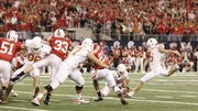 Texas kicker Hunter Lawrence (15) kicks the game-winning field goal against Nebraska in last season’s Big 12 Championship in Arlington, Texas. The two teams will meet in an intense battle on Oct. 16 in Lincoln, Neb.