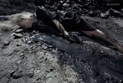 This image provided by Steven Meisel for Vogue Italia shows an image from the August issue featuring Kristen McMenamy in photo spread titled “Water & Oil.”