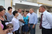 Russian Prime Minister Vladimir Putin, second right, speaks Tuesday with residents whose houses burned to the ground in a forest fire in the village of Polyana, Ryazan region, some 111 miles southeast of Moscow. Putin has been a very visible leader in the battle against the fires, which have caused billions of dollars in damage and left thousands homeless in the past two weeks.