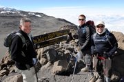 Amputee war veterans, from left, Kirk Bauer, 62, Ellicott City, Md.; Neil Duncan, 26, Denver; and Dan Nevins, 37, Jacksonville, Fla., pose together at Gilman’s point before making the last push to the summit of Mt Kilimanjaro, Tanzania, in this Aug. 6 photo released by Disabled Sports USA. Bauer lost his leg in Vietnam; Duncan lost both legs in Afghanistan and Nevins lost both legs in Iraq.