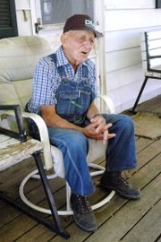 Max Moore, 92, shown at his farm near Baldwin City, won the first tractor pull at the Vinland Fair in the early 1960s. "They gave me an old flour sack with 50 silver dollars in it," he said. "I&squot;ve still got them."