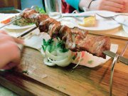 KU student Godfrey Riddle samples a shashlik at a Georgian restaurant a few blocks off of St. Petersburg’s main street, Nevsky Prospect. Shashlik is made in the Turkic style by grilling meat that has been seasoned with salt, pepper, and lime juice over an open fire on a skewer. Riddle said it was a menu staple through his visits in Russia and one of his favorite aspects of Russian cuisine.