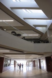 Light from skylights fill the hallways in the new School of Pharmacy building on Kansas University’s West Campus. The building is being made ready to open its doors to students and faculty.