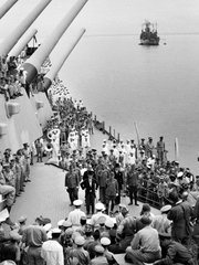 Japanese officials, center, stand in a group facing representatives of the Allied armed forces prior to signing the surrender agreement Sept. 2, 1945, on the deck of the USS Missouri in Tokyo Bay, during a ceremony marking the end of World War II.