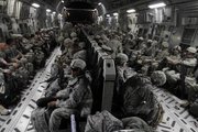 U.S. Army soldiers from 4th Brigade, 2nd Infantry Division, are seen Friday on board a military aircraft in Baghdad as they begin their journey home. These soldiers are part of the last brigade of combat troops that are now leaving Iraq, heading home as part of the U.S. drawdown of forces.