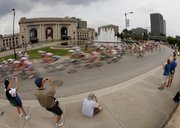 A blur of cyclists race past Kansas City’s Union Station on Sept. 13, 2009, during the Tour of Missouri. Smack in the middle of the country, it is people at Union Station who generally scurry in different directions as they pursue their destinations. In 2010, a year of fragmentation if there ever was one, watching them scatter is not unlike how American voters view politics.