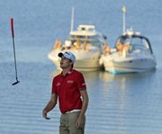 Nick Watney flips his club after missing a birdie putt on the 17th hole during the third round of the PGA Championship. Watney took a three-shot lead Saturday in Sheboygan, Wis.