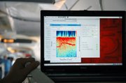 One of the specialized radars developed by CReSIS engineers at KU shows a distinct layer (in red) within the ice sheet on a real-time display. The radars also capture more detailed information that can be interpreted with additional computing power.