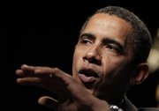 President Barack Obama talks about the economy Monday at the U.S. Cellular Arena in Milwaukee. Obama started a three-day fundraising trip Monday for Democrats in November elections. In Wisconsin, he is raising money for gubernatorial candidate Tom Barrett and other Democrats in the state.
