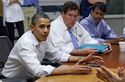 President Barack Obama, accompanied by Plaquemines Parish President Billy Nungesser, center, and Louisiana Gov. Bobby Jindal, gets a briefing on the oil spill May 28 at the U.S. Coast Guard Station in Grand Isle, La. For months, the U.S. government talked with boot-on-the-neck toughness about BP, with the president wondering aloud about whose butt to kick. But privately, it worked hand-in-hand with the oil giant to cap the runaway Gulf well and chose to effectively be the company’s banker — allowing future drilling revenues to potentially be used as collateral for a victim compensation fund.