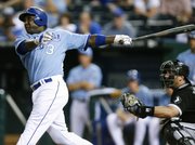 Kansas City’s Yuniesky Betancourt (3) hits a grand slam as Chicago catcher A.J. Pierzynski looks on in the seventh inning. The Royals held off the White Sox, 6-5, on Saturday in Kansas City, Mo.