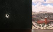 A bullet hole from a gun battle in Ciudad Juarez is seen on the wall of El Paso Assistant City Manager Pat Adauto’s office in El Paso, Texas, in this June 30 file photo. Juarez and the area where the gun fight took place can be seen out the window of Adauto’s office.
