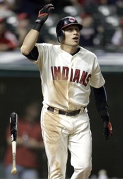 Cleveland’s Asdrubal Cabrera watches his game-winning solo home run off Kansas City relief pitcher Jesse Chavez in the 10th inning. The shot lifted the Indians to a 4-3 victory Saturday in Cleveland.