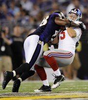 Baltimore Ravens linebacker Edgar Jones sacks New York Giants quarterback Rhett Bomar (5) during the second half of an NFL preseason football game on Saturday in Baltimore. The Ravens topped the Giants, 24-10, to move to 3-0 this preseason.