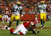 Kansas City Chiefs tight end Leonard Pope (45) lands in the end zone for a touchdown in front of Green Bay Packers safety Charlie Peprah (46) and linebacker Alex Joseph in the first half. The Chiefs beat the Packers, 17-13, Thursday in Kansas City, Mo.