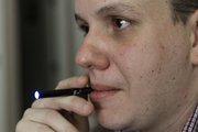 Galen Kipe demonstrates the use of an electronic cigarette in Asheboro, N.C. The 34-year-old has tried quitting a number of times, and eventually swapped real smokes for electronic ones.