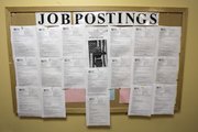 A jobs postings board shows openings at Central City Concern employment access center Monday in Portland, Ore. Job openings rose in July after two months of declines, a positive sign that companies could step up hiring soon.