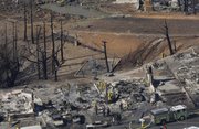 Fire crews work on the remains of homes damaged by a massive fire in a mostly residential neighborhood Friday in San Bruno, Calif. Fire crews tried to douse the remnants of an enormous blaze and account for the residents of dozens of homes Friday after a gas line ruptured and an explosion ripped through a neighborhood near San Francisco.