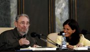 Cuba’s leader Fidel Castro, left, and Cuban journalist and biographer Katiuska Blanco, attend the presentation of Castro’s new book “La Contra Ofensiva Estrategica,” or “The Strategic Counter Offensive,” Friday at the University of Havana.