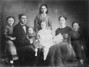 The Patrick Mungan family was among those who survived Quantrill's Raid in 1863. Patrick, a lime burner and builder, saw business opportunities in Kansas City and moved there, but his older daughter, Katie (standing in back) maintained her Lawrence allegiances and attended raid survivor reunions in 1913 and 1925.