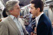 Michael Douglas portrays Gordon Gekko, left, and Shia LaBeouf portrays Jake Moore in a scene from “Wall Street: Money Never Sleeps.”