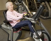 Mike Yoder/Journal-World Photo.Dorothy McGregor, 91, works out every day at the Lawrence Athletic Center. Rotating through one of several exercise stations McGregor uses a recumbent stationary bike while watching the news Wednesday, Sept. 21, 2001,
