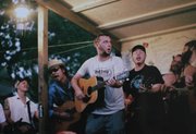 Musicians perform on a campground stage at the Walnut Valley Music Festival in Winfield Sept. 18. I used an old film camera with a 50mm lens and Fujicolor 800 speed film. Using film meant I could not check my work as I shot — a big advantage in digital photography.