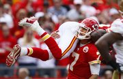 Chiefs quarterback Matt Cassel (7) lifts wide receiver Dwayne Bowe after a second-half touchdown. Cassel threw three TDs Sunday.