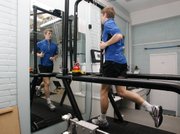 British middle distance runner Colin McCourt runs on a machine for research Tuesday in a lab at St. Mary’s University College in London. Some experts say adding beetroot juice to your diet could give you a performance boost.