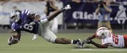 Kansas State running back Daniel Thomas (8) is tackled by Nebraska defensive back Eric Hagg on Thursday in Manhattan.