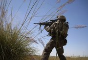 Lance Cpl. Wesley Samuels, of Winter Haven, Fla., with the 2nd Battalion, 9th Marines’ Echo Company, fires at Taliban insurgents during a gunbattle in Marjah, Afghanistan, in this Sept. 26 photo. The Taliban are still in Marjah in force, waging a full-blown guerrilla insurgency that rages daily across a bomb-riddled landscape of agricultural fields and irrigation trenches.