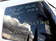 A message written on a vehicle window Oct. 1 at Seth Walsh’s memorial service at the First Baptist Church in Tehachapi, Calif. The gay teen, who police determined was bullied for at least the past two years, was found Sept. 19 by his family, unconscious after he hanged himself from a tree in their backyard, according to police reports. He died the next day.