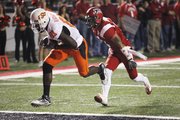 Oklahoma State wide receiver Justin Blackmon (81) pulls in a touchdown pass in front of Orkeys Auriene. Oklahoma State defeated Louisiana Lafayette, 54-28, on Friday in Lafayette, La.