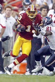Washington Redskins wide receiver Anthony Armstrong carries the ball against the Houston Texans on Sept. 19 in Landover, Md. Washington is 2-2 entering today's game against Green Bay.