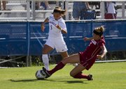 Oklahoma forward Jordan White (7) knocks the ball away from Kansas University forward Kortney Clifton (5) Sunday afternoon at the Jayhawk Soccer Complex. Oklahoma won the game 1-0.