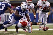 Indianapolis running back Mike Hart extends to score the game’s lone touchdown while being tackled by Kansas City defensive back Kendrick Lewis in the fourth quarter.