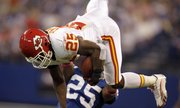 Kansas City Chiefs running back Jamaal Charles, top, leaps over Indianapolis Colts cornerback Jerraud Powers in the first quarter. Charles — and the Chiefs — eventually came back to earth in a 19-9 loss Sunday in Indianapolis.