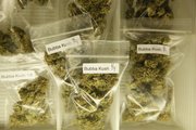 Marijuana is shown for sale Friday at the San Francisco Medical Cannabis Clinic in San Francisco. Attorney General Eric Holder says the federal government will enforce its marijuana laws in California even if voters next month make the state the first in the nation to legalize the drug.