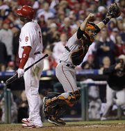 San Francisco Giants catcher Buster Posey reacts after Philadelphia Phillies’ Ryan Howard (6) strikes out to end the NLCS. The Giants won the game, 3-2, on Saturday in Philadelphia to advance to the World Series.