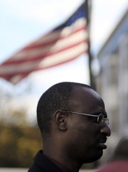 Claude Rwaganje, a resident of Portland, Maine, for over 13 years, speaks Tuesday at a news conference. Portland residents will vote in November on a proposal that would give legal residents who are not U.S. citizens the right to vote in local elections.