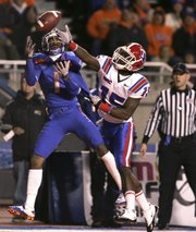 Boise State’s Titus Young (1) goes up for a pass against Louisiana Tech’s Josh Victorian (15). The pass was incomplete Tuesday in Boise, Idaho.