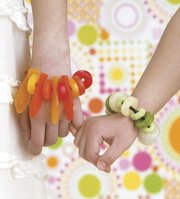 Candy bracelets from "Candy Construction," by Sharon Bowers. Bowers has an ingenious trick for distracting children from their post-Halloween sugary stashes: Use the candy as construction materials in crafts.