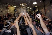 The San Francisco Giants celebrate after winning the World Series. The Giants defeated the Texas Rangers, 3-1, in Game 5 on Monday in Arlington, Texas.