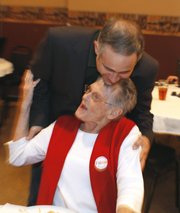 Republican Tim Huelskamp gets a hug from supporter, Joyce Knott, of Plains, Kan., at the watch party in Dodge City, Kan. He is running for the Kansas 1st District Congress Tuesday, Nov. 2, 2010.