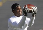 Kansas receiver Chris Omigie pulls in a pass during warmups prior to kickoff against Colorado, Saturday, Nov. 6, 2010, at Kivisto Field.